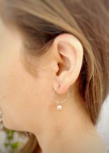Silver hoop earrings with interchangeable charms