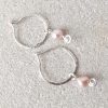 Silver hoop earrings with freshwater pearl charms