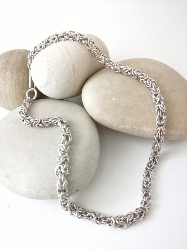 Silver chain necklace woven in the byzantine pattern style. classic and timeless jewelry you ma y wear all year long
